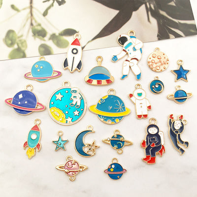 Colorful moon charms arranged on a light background