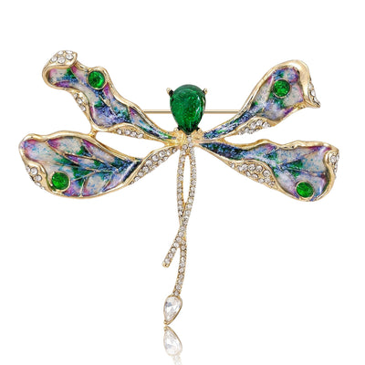Green Dragonfly, Red Dragonfly brooch styles arranged on a light display