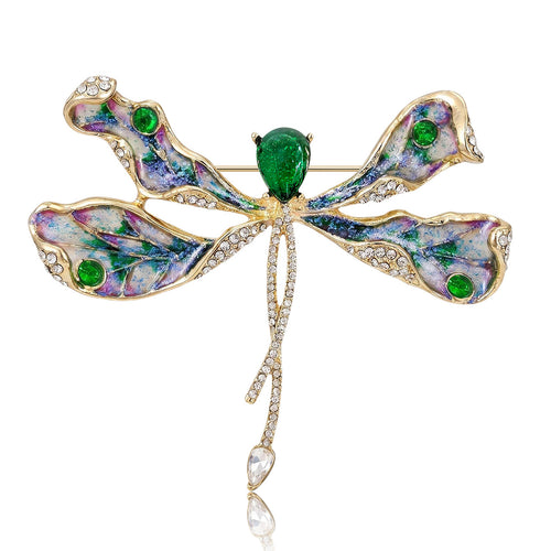 Green Dragonfly, Red Dragonfly brooch styles arranged on a light display