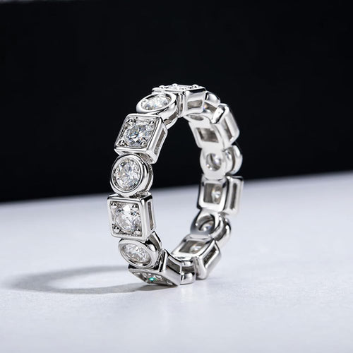 Angled studio view of white gold round-square eternity band