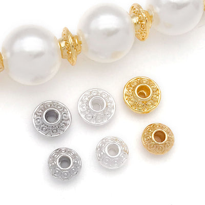 Metal flying saucer spacer beads in two shapes arranged as a full product overview