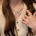 White Pearl Bow Necklace and Bracelet in Two Separate Styles view 1