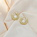 Gold Tone Compact Huggie White Pearl Look Center Bead Earrings view 1