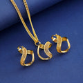 Gold Tone Gold Infinity Loop Geometric Metal Necklace and Earring Set view 2
