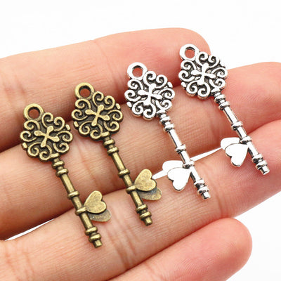 ornate skeleton key charms assortment showing the available designs and finishes