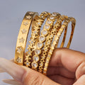 Crystal Hinged Bangle Collection in Five Gold and Silver Designs view 1