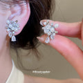 Pearl Cluster Floral Dangle Clip On Earrings With Polished Metal Details view 4