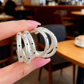 Triple Curved Hoop Earrings with Black Dot Details view 4