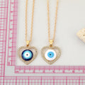 Gold Tone Crystal Open Heart Realistic Eye Pendant Necklaces view 3