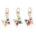 Gold Tone Pressed Flower Butterfly Resin Clip Keychains view 1