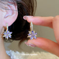 Purple Crystal Flower Huggie Earrings With Decorative Metal Details view 2
