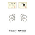 Silver Tone Clear Stone Loop Bow Earrings In Stud And Clip On Styles view 3