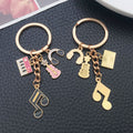 Pink-Led Music Note Piano Violin and Headphone Charm Keychain Collection view 3