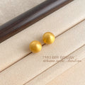 Matte Gold Tone Round Ball Stud Earrings In Five Graduated Sizes view 7