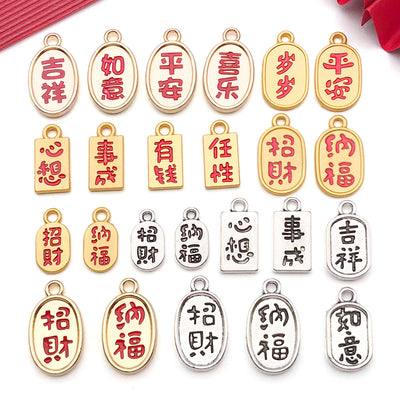 Gold-tone assorted shape charms arranged on a light background