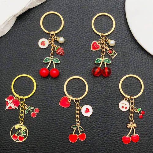 Alternate arrangement of the red cherry strawberry heart metal keychain showing its hardware and charm details