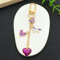 Purple Heart Butterfly and Carousel Metal Clasp Keychain Set view 4