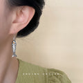 Silver Tone Textured Fish Dangle Earrings Orange Crystal Eyes view 2