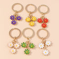 Enamel Daisy Flower Keychain with Three Charms on Split Key Ring view 1
