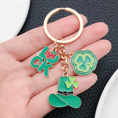 Main display of two green hat clover and lucky letter keychains