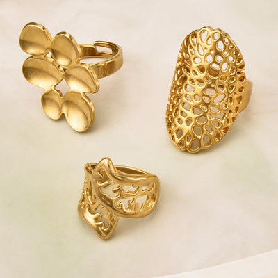 Three gold openwork statement rings flower mesh cutout product group