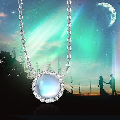 Front product view of silver tone blue white round stone halo pendant necklace