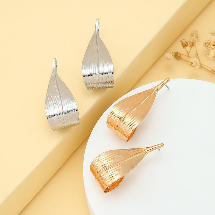 Curved Cutout Leaf Gold and Silver Statement Stud Earrings