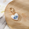Gold Tone Evil Eye Heart Charms with Large Lobster Clasps in Six Designs view 2