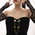 Long Gold Station Necklace White Sea Shell and Metal Discs view 2