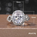 Oval White Stone Ring with Round Side Stones and Pavé Band view 5