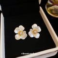 White Petal Flower Stud Earrings with Gold Tone Centers view 2