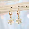 Gold Tone Huggie Earrings with Crystal Daisy and Bow Charm Drops view 3