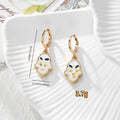 Gold Tone Pressed Flower Hamsa Huggie Earrings in Nine Options view 2
