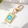 Gold Tone Wavy Rectangle Resin Evil Eye Clip Keychains in Six Colors view 6