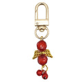 Red Bead Angel Wings Jingle Bells Gold Clasp Keychain view 5