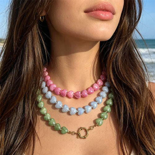Alternate view showing the shape and hardware of the pictured heart bead necklaces