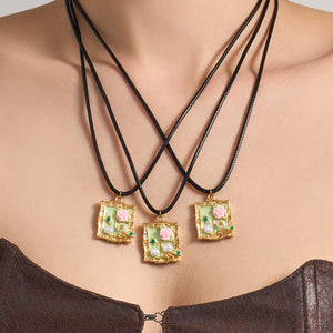 Long Black Cord Necklace with Green Floral Frame Pendant