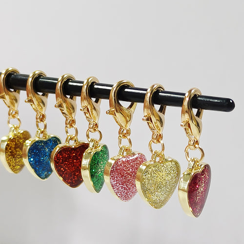 Close-up showing the colors and surface details of gold Tone Glitter Heart Lobster-Clasp Charms in Seven Color Options