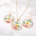 Gold Tone Round Pressed Flower Resin Necklace and Earring Options view 1