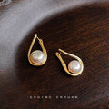 Gold Tone Open Teardrop Frame And White Pearl Stud Earrings view 3