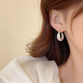 Rounded White Inlay Hoop Earrings in Gold Tone Polished Metal Jewelry view 3