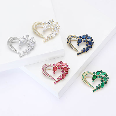 Front view of open heart crystal brooch with leaf cluster decorative metal pin