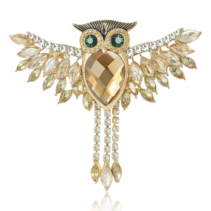 Wide-Wing Owl Brooch In Metal With A Faceted Center, Marquise Crystal Wings, And Hanging