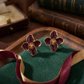 Burgundy Four Petal Flower Gold Tone Stud Earrings view 4