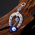 Silver Tone Horseshoe and Fish Blue Evil Eye Keychains in Three Designs view 2