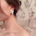 Burgundy Four Petal Flower Stud Earrings With Gold Tone Centers view 2