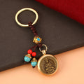 Brass Rotating Guardian Deity Keychain with Green Bead Cord