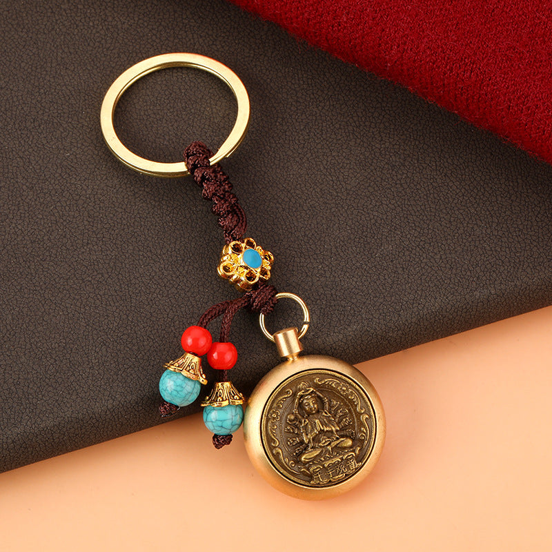 Brass Rotating Guardian Deity Keychain with Green Bead Cord