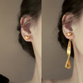 Matte Wavy Ribbon Drop Stud Earrings in Gold and Silver view 1