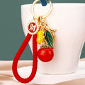 Persimmon Peanut and Leaf Charm Keychain with Braided Wrist Loop view 2
